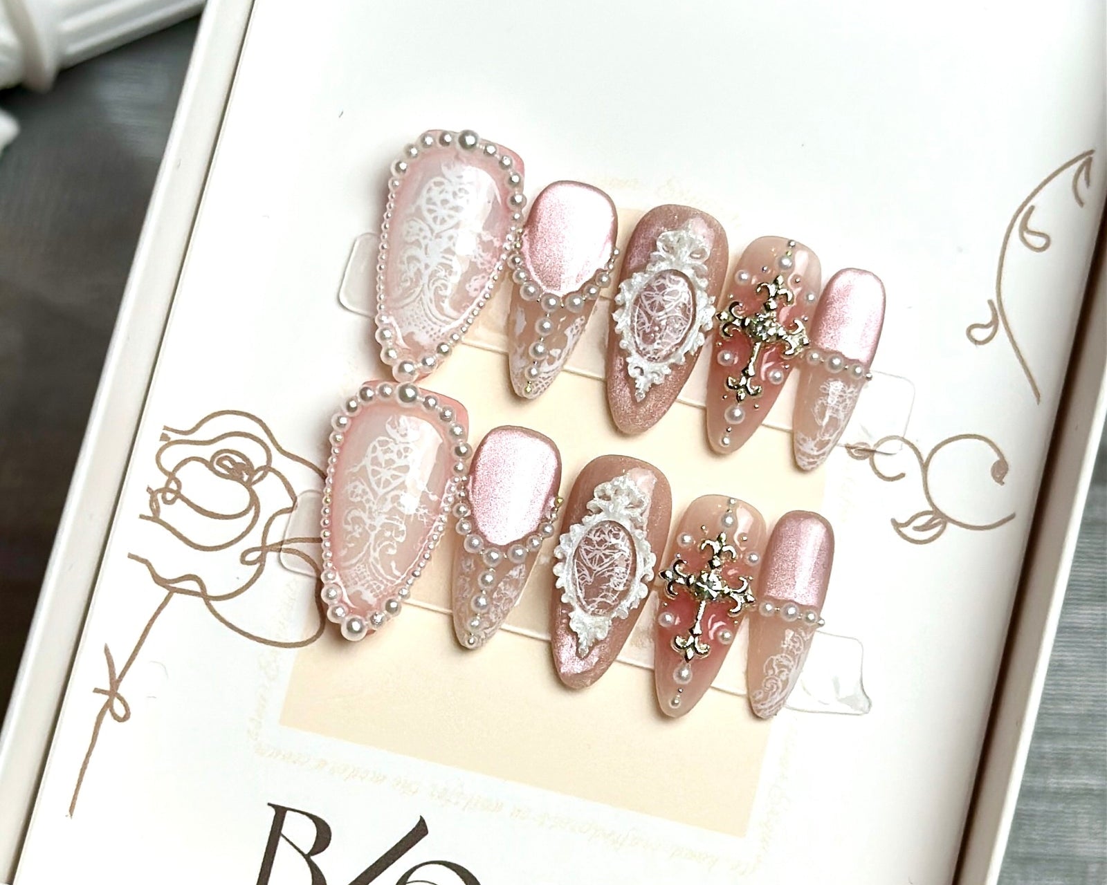 Caught Blushing medium stiletto press-on nails by Bloom Nails, a full set in the box
