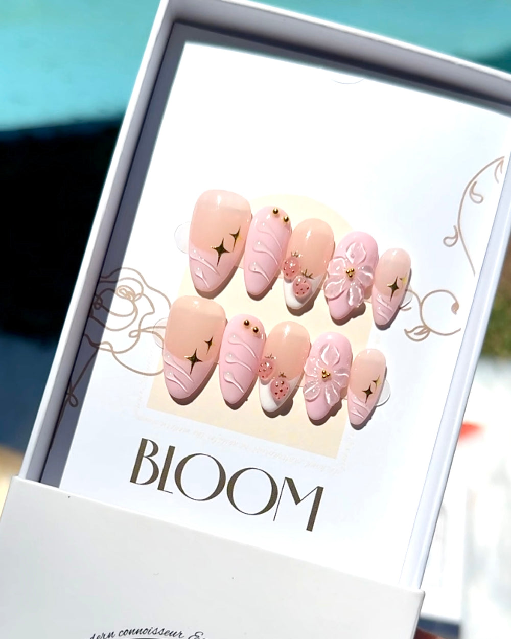 Strawberry Stardust handmade medium almond press-on nails by Bloom Nails