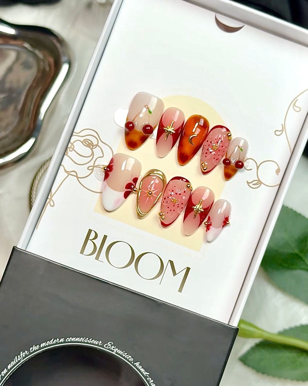 Cherry Eclipse handmade medium almond press-on nails by Bloom Nails
