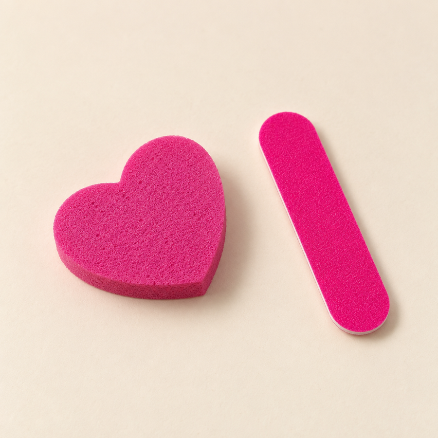 Pink heart buffer and nail file included in the Complete Salon Prep Kit
