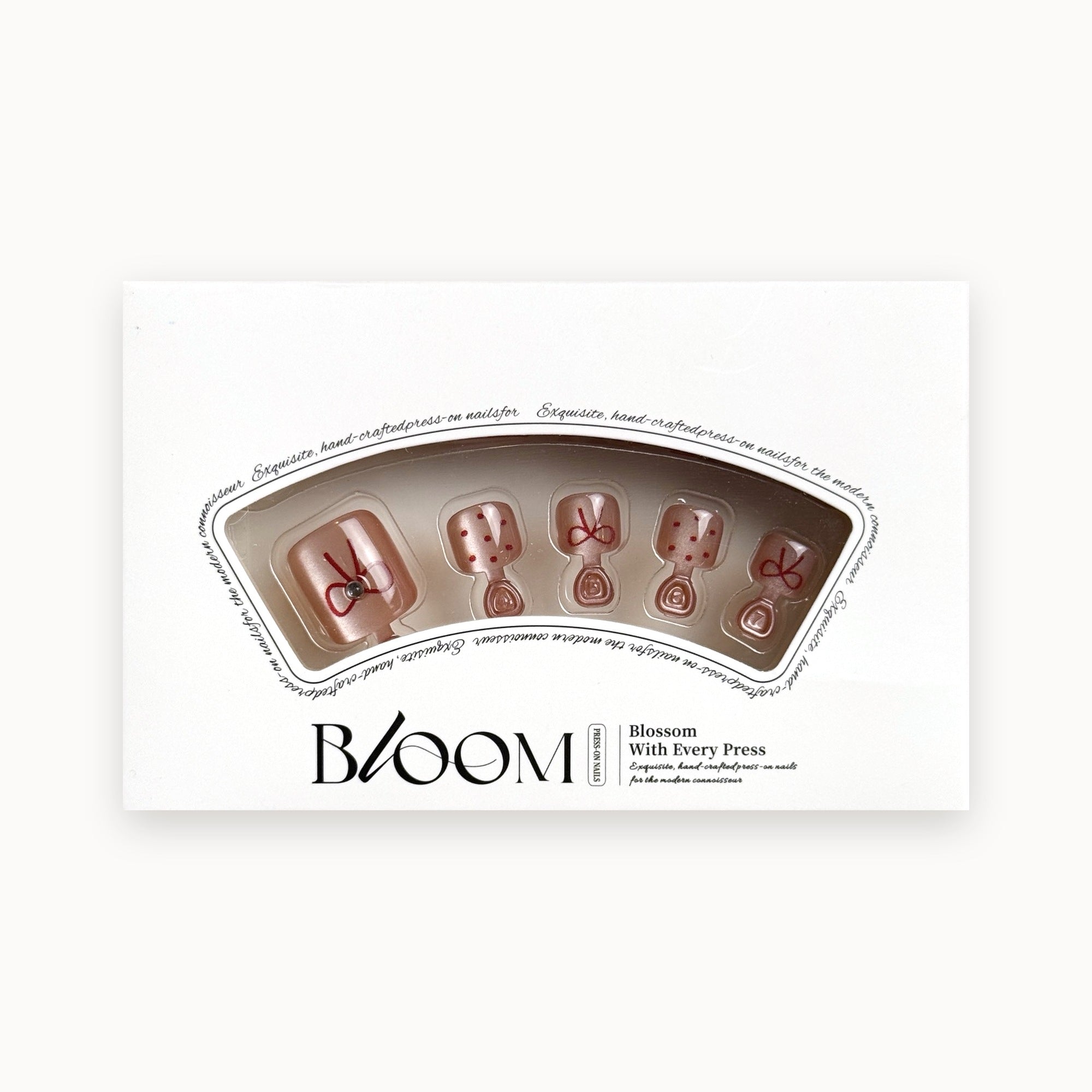 Bloom Tied in Rouge press-on toenails (red bows and dots on sheer pink) in the Bloom box