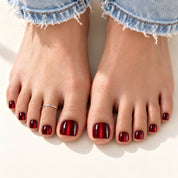 Bloom Midnight Merlot press-on toenails (burgundy wine-red cat-eye) worn with cuffed jeans