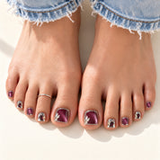 Bloom Plum Royale press-on toenails (plum cat-eye with crystals) worn with cuffed jeans