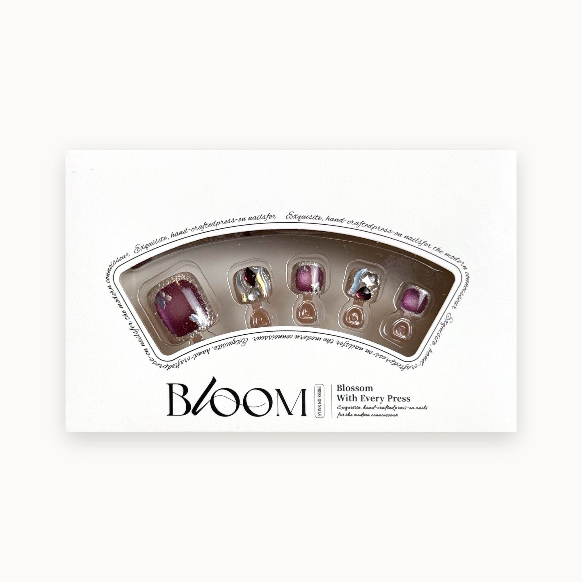Bloom Plum Royale press-on toenails (plum cat-eye with crystals) in the Bloom box
